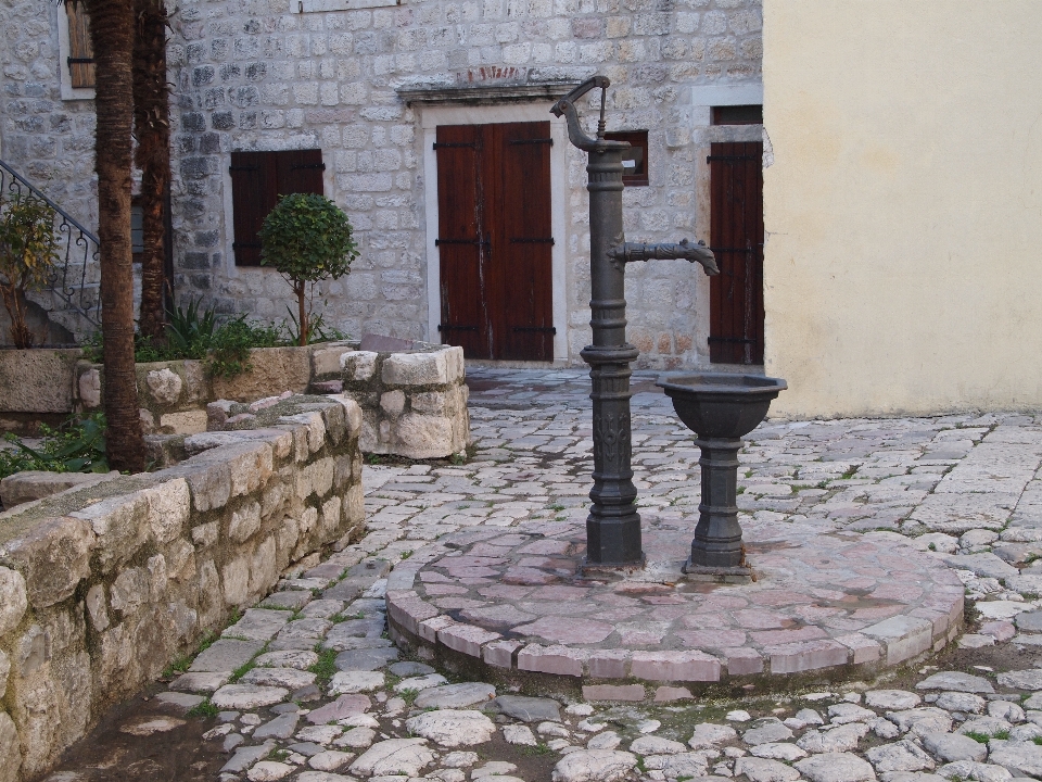 Building cobblestone wall walkway