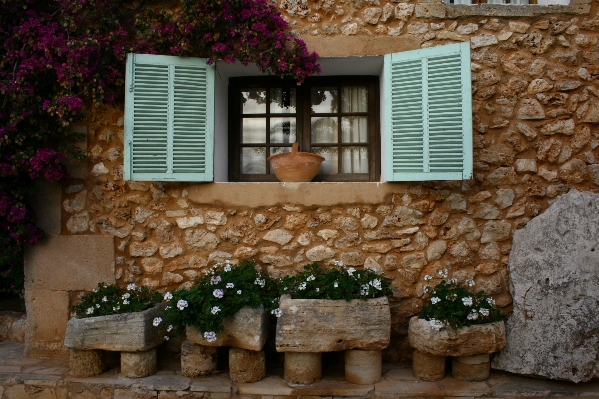 Wood house flower window Photo