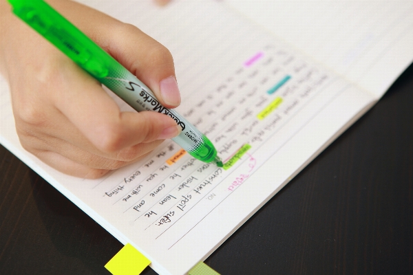 Writing hand fluorescent marking Photo