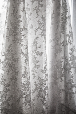 Black and white woman lace curtain Photo