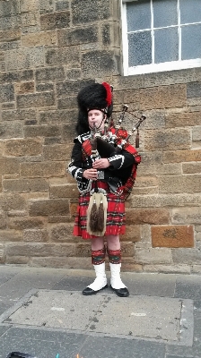 Red clothing musical instrument scotland Photo