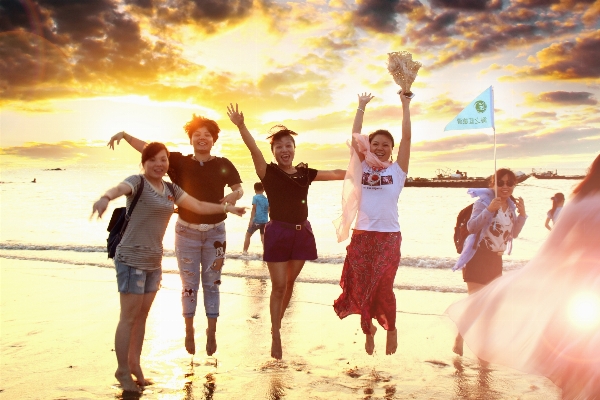 Beach people jumping young Photo