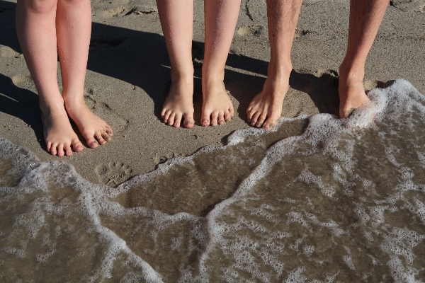 Hand beach sea water Photo