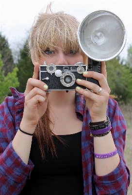 Hand girl hair camera Photo