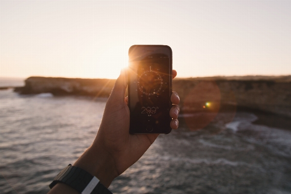 Mobile hand screen beach Photo