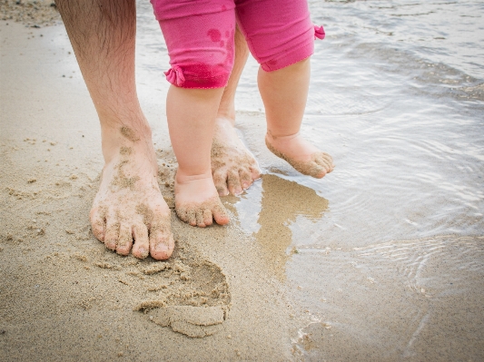 Sand girl woman leg Photo