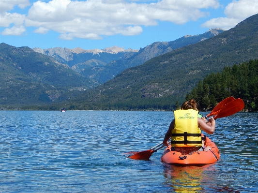 Water person mountain boat Photo