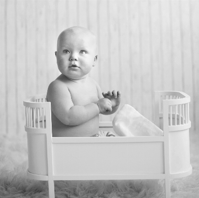 Black and white boy sitting Photo