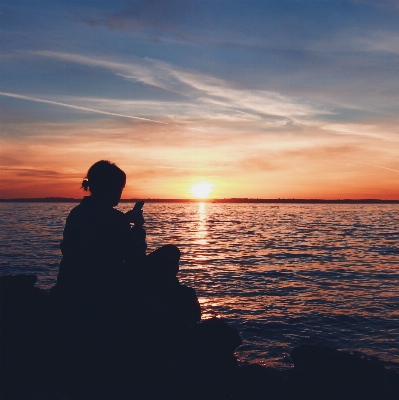 Smartphone typing beach sea Photo