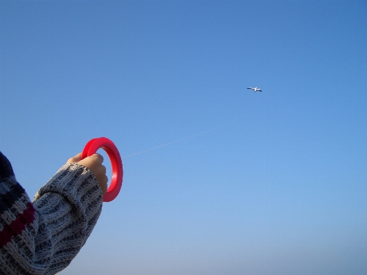 Hand sky play wind Photo