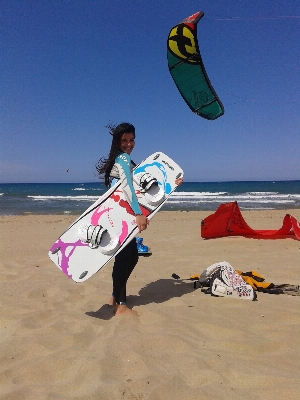 Beach girl wind surfboard Photo