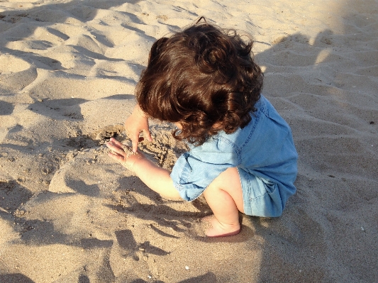 Hand beach water sand Photo