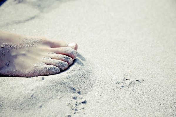 Hand beach sand white Photo