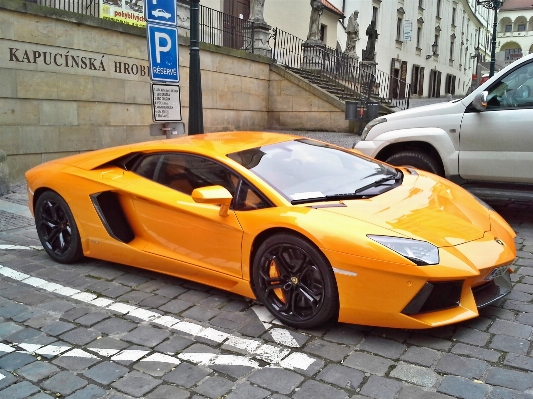 Car wheel orange vehicle Photo