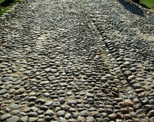 Rock cobblestone wall asphalt Photo