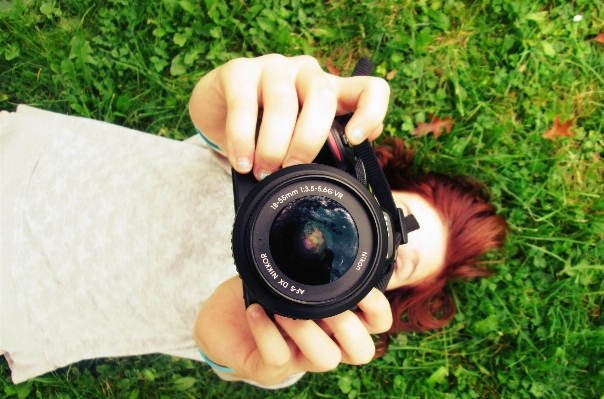 Hand grass girl camera Photo