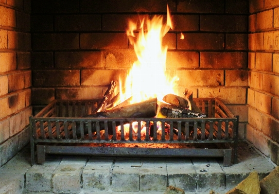 Warm log fire fireplace Photo