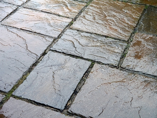 Rock sidewalk floor wet Photo