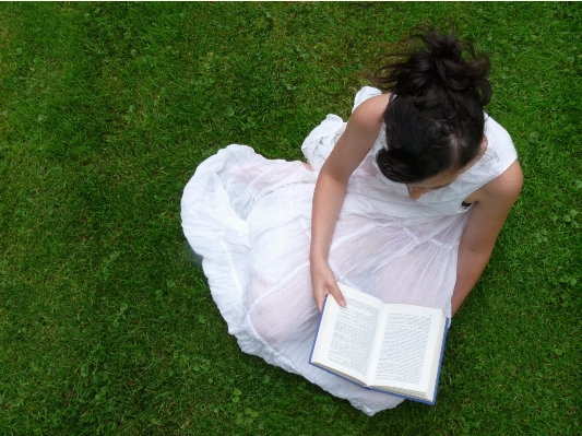 Hand grass book girl Photo