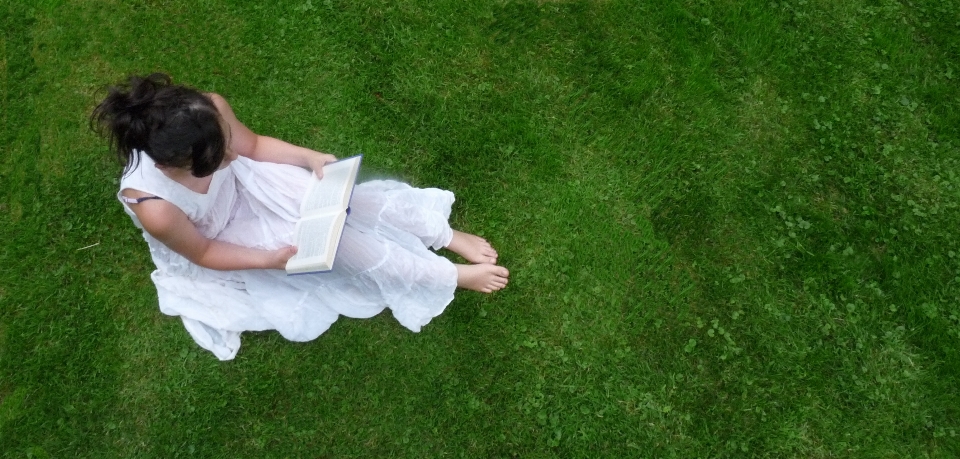 Hand grass book girl