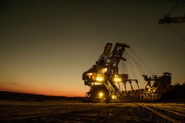 Arbeiten sand sonnenuntergang traktor Foto