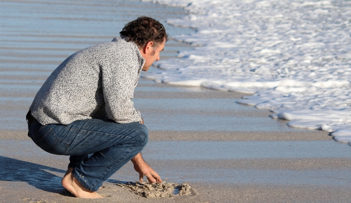 Man beach sea water Photo