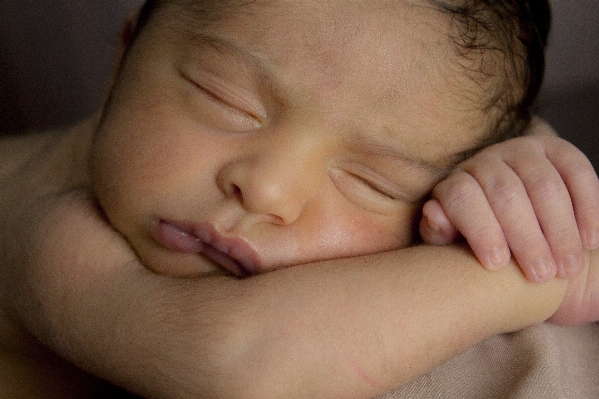 Hand person sleeping child Photo