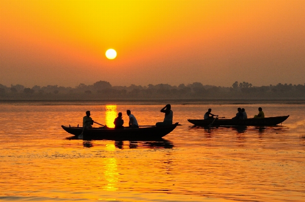 Sea sunrise sunset boat Photo