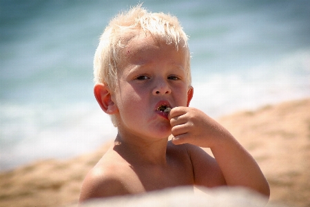 Hand man beach sea Photo