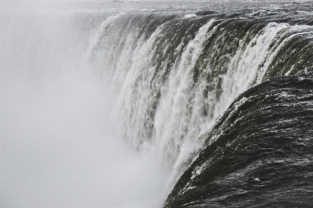 Sea water waterfall black and white Photo