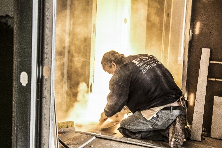 Man street construction welding Photo