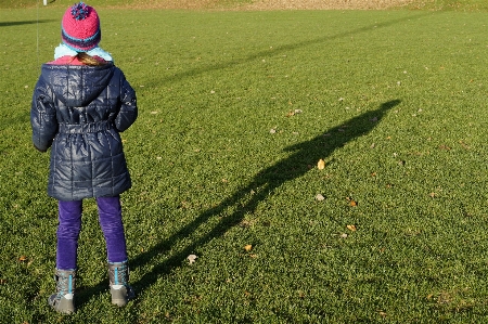 Grass sky girl sun Photo