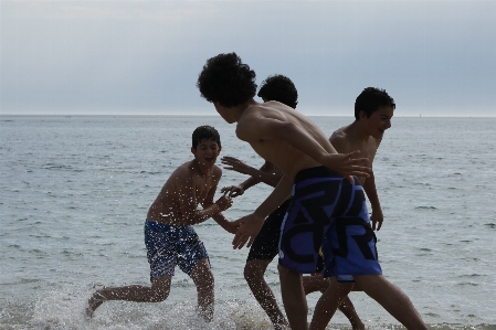 Man beach sea coast Photo