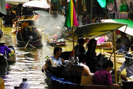 Water people boat fruit Photo