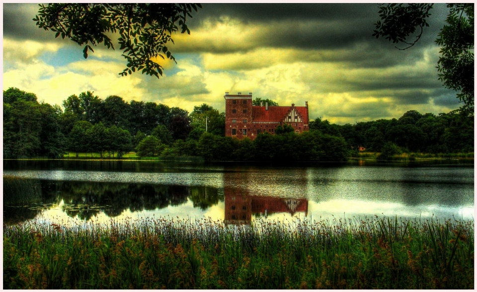 Meadow morning lake building