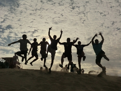 Sand people desert jump Photo