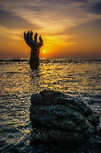 Hand beach sea coast Photo