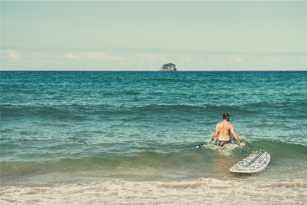 Man beach sea coast Photo