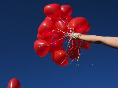 Hand flower petal balloon Photo