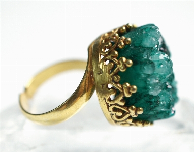 Ring stone green golden Photo