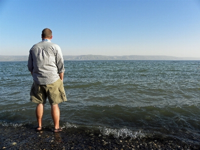 Man beach sea coast Photo