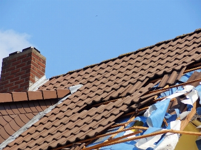 Roof storm tile roofer Photo