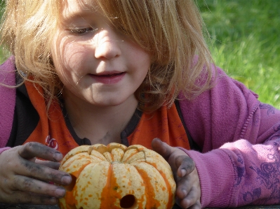 Girl play autumn pumpkin Photo