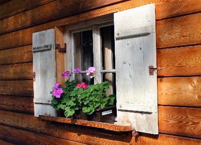 Wood house flower window Photo