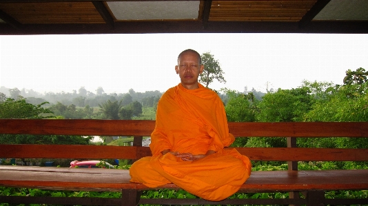 Person sitting monk meditate Photo