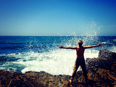 Man beach sea coast Photo