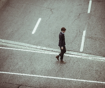 Pedestrian walking person suit Photo