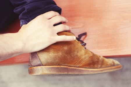 Hand man shoe wood Photo