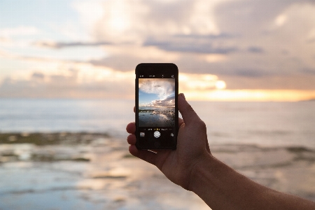 Iphone smartphone hand beach Photo