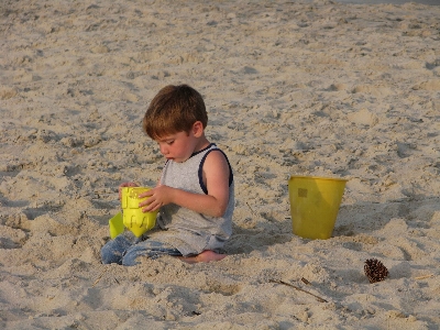 Beach sand people play Photo